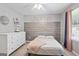 Bright bedroom features a large window, soft colors, and comfortable carpet at 8340 Highway 54, Sharpsburg, GA 30277