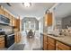 Well-appointed kitchen with wood cabinets, offering a functional and inviting space for cooking and dining at 8340 Highway 54, Sharpsburg, GA 30277