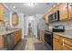 Well-lit kitchen features stainless steel appliances and granite countertops at 8340 Highway 54, Sharpsburg, GA 30277