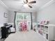 Comfortable living room with a ceiling fan, providing a welcoming space for relaxation and entertainment at 8340 Highway 54, Sharpsburg, GA 30277