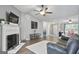 Comfortable living room featuring a fireplace and open layout, creating an inviting space for relaxation at 8340 Highway 54, Sharpsburg, GA 30277