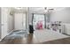 Bright and airy living room with hardwood floors, featuring a ceiling fan and plenty of natural light at 8340 Highway 54, Sharpsburg, GA 30277