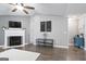 Open living room with vaulted ceiling and fireplace is perfect for entertaining at 8340 Highway 54, Sharpsburg, GA 30277