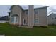 Expansive backyard with a concrete patio area, perfect for entertaining at 705 Mustang Ct, Hampton, GA 30228