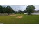 Spacious backyard with green grass and a white fence around the perimeter at 705 Mustang Ct, Hampton, GA 30228