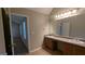 Bathroom with a double vanity, providing plenty of space for personal care at 705 Mustang Ct, Hampton, GA 30228