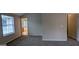 Bedroom featuring a neutral color palette and doorway to an ensuite bathroom at 705 Mustang Ct, Hampton, GA 30228