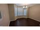 Bright dining room featuring a bay window and an elegant chandelier at 705 Mustang Ct, Hampton, GA 30228
