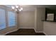 Inviting dining area with natural light and a decorative chandelier at 705 Mustang Ct, Hampton, GA 30228