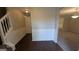 View of front hallway with classic wainscotting and hardwood flooring at 705 Mustang Ct, Hampton, GA 30228