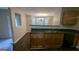 Features kitchen with wood cabinets, a sink and a dark countertop at 705 Mustang Ct, Hampton, GA 30228