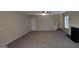 Living room featuring a staircase, white fireplace, and a neutral color palette at 705 Mustang Ct, Hampton, GA 30228