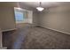 Cozy living room with neutral carpet and a decorative chandelier at 705 Mustang Ct, Hampton, GA 30228
