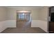 Spacious living room with wainscotting and an elegant chandelier at 705 Mustang Ct, Hampton, GA 30228