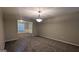 Inviting living room with carpet and a decorative chandelier at 705 Mustang Ct, Hampton, GA 30228