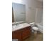 Bathroom featuring a single sink vanity, toilet, tub/shower combo, and beige colored walls at 755 Magnolia Gardens Walk, Mcdonough, GA 30253