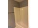 Clean bathroom featuring standard tub and shower combination with vinyl surround at 755 Magnolia Gardens Walk, Mcdonough, GA 30253