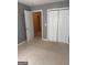 Cozy bedroom with wall-to-wall carpeting and closet for storage at 755 Magnolia Gardens Walk, Mcdonough, GA 30253