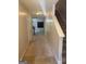 Inviting hallway leading to the kitchen and featuring staircase to the upper level at 755 Magnolia Gardens Walk, Mcdonough, GA 30253