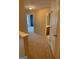 Hallway featuring neutral color walls, carpet flooring, and white doors at 755 Magnolia Gardens Walk, Mcdonough, GA 30253