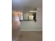 Open-concept living space featuring a breakfast bar and seamless flow to hallway and kitchen at 755 Magnolia Gardens Walk, Mcdonough, GA 30253
