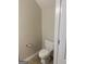 Neat half-bathroom featuring a standard toilet and tile flooring at 755 Magnolia Gardens Walk, Mcdonough, GA 30253