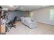 Finished basement with carpeted floors, drop ceiling, and a walk-out to the backyard at 301 East Highway 5, Roopville, GA 30170