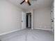 Bedroom features a light gray color scheme, gray carpeting, ceiling fan, and a closet at 301 East Highway 5, Roopville, GA 30170