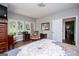 Comfortable bedroom features abundant natural light and classic wood furnishings, perfect for relaxation at 301 East Highway 5, Roopville, GA 30170