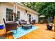 Back deck with an outdoor seating area and a view of the private wooded lot at 301 East Highway 5, Roopville, GA 30170