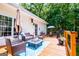 Deck with an outdoor seating area, fire pit, and beautiful view of the backyard at 301 East Highway 5, Roopville, GA 30170