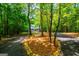 Circular driveway lined with colorful rocks leading to a home at 301 East Highway 5, Roopville, GA 30170