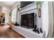 Close-up view of the fireplace and brick hearth at 301 East Highway 5, Roopville, GA 30170