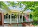 Inviting home with a cozy front porch, brick accents, classic shutters, and a well-maintained yard at 301 East Highway 5, Roopville, GA 30170