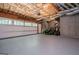 Large garage with exposed insulation, window, and garage door opener at 301 East Highway 5, Roopville, GA 30170