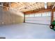 Spacious garage with insulation, windows and a white garage door at 301 East Highway 5, Roopville, GA 30170