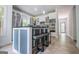 Bright, open kitchen with central island with seating, stainless appliances, and large windows at 301 East Highway 5, Roopville, GA 30170
