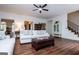 Spacious living room with wood floors, a ceiling fan, and neutral-toned furnishings at 301 East Highway 5, Roopville, GA 30170