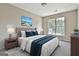 Serene bedroom featuring a luxurious bed, soft lighting, and a view from a bright window at 1255 Silverstone Trl, Jonesboro, GA 30238