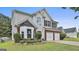 Charming two-story home with a two-car garage, bay window, and beautifully landscaped front yard at 1255 Silverstone Trl, Jonesboro, GA 30238