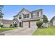 Beautiful two-story house featuring a two-car garage, bay window, and a well-maintained yard at 1255 Silverstone Trl, Jonesboro, GA 30238
