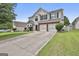Charming two-story home with a two-car garage, bay window, and a well-manicured front lawn at 1255 Silverstone Trl, Jonesboro, GA 30238