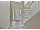 Entryway with modern floors, stairs, and a decorative glass front door at 1255 Silverstone Trl, Jonesboro, GA 30238