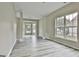 Spacious living area with large windows, modern flooring, and neutral paint at 1255 Silverstone Trl, Jonesboro, GA 30238