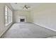 Large living room with carpet and fireplace at 1255 Silverstone Trl, Jonesboro, GA 30238