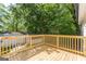 Wooden deck with a view of the well-maintained lawn and the white storage building at 1446 Westmont Sw Rd, Atlanta, GA 30311
