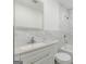 This bright bathroom offers a sleek vanity, marble-look tiles, and a shower-tub combination at 1446 Westmont Sw Rd, Atlanta, GA 30311