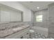 The bathroom features a new vanity, tub-shower combination with subway tile at 1446 Westmont Sw Rd, Atlanta, GA 30311