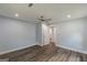 This light-blue bedroom features wood-look floors, recessed lights, and doorway to the bathroom at 1446 Westmont Sw Rd, Atlanta, GA 30311