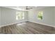 This bedroom offers great natural light, ceiling fan, and wood-look flooring at 1446 Westmont Sw Rd, Atlanta, GA 30311